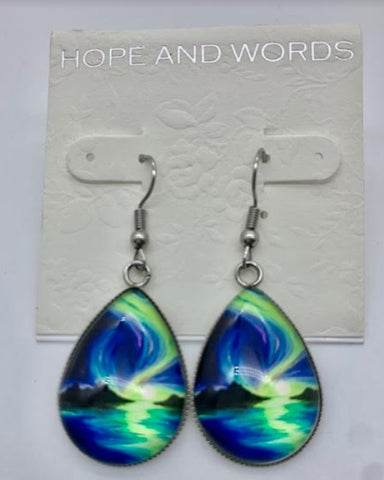 Northern lights oval wire earrings over the sea